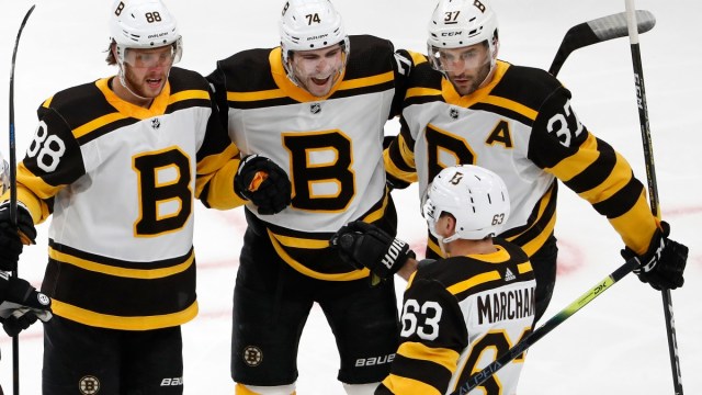 Boston Bruins right wing David Pastrnak (88), left wing Jake DeBrusk (74), center Patrice Bergeron (37) and left wing Brad Marchand (63)