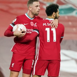 Liverpool midfielder Jordan Henderson (left) and forward Mohamed Salah