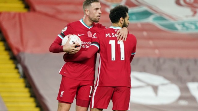 Liverpool midfielder Jordan Henderson (left) and forward Mohamed Salah