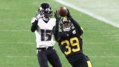 Pittsburgh Steelers free safety Minkah Fitzpatrick (39) and Baltimore Ravens wide receiver Marquise Brown (15)