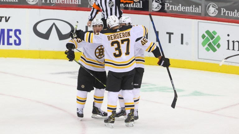 Boston Bruins Forwards Patrice Bergeron, Brad Marchand And David Krejci