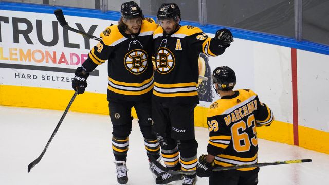 Boston Bruins center Patrice Bergeron, right wing David Pastrnak and left wing Brad Marchand