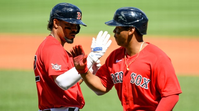 Boston Red Sox shortstop Xander Bogaerts (2) and third baseman Rafael Devers (11)