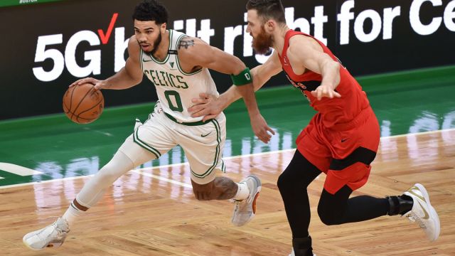 Boston Celtics forward Jayson Tatum and Toronto Raptors center Aron Baynes