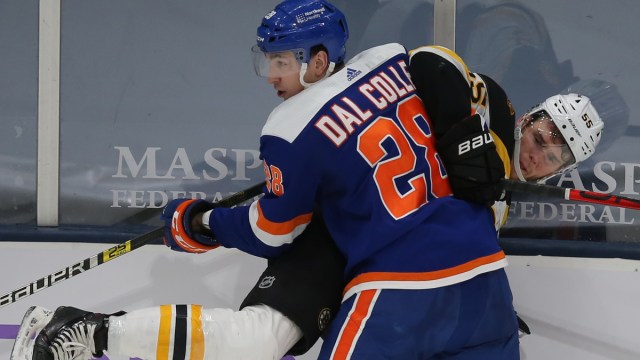 New York Islanders left wing Michael Dal Colle, Boston Bruins defenseman Jeremy Lauzon