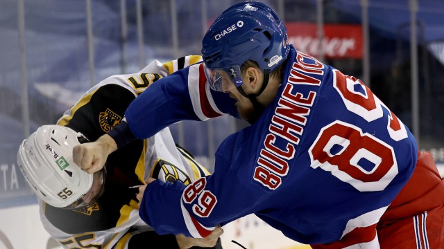 Boston Bruins defenseman Jeremy Lauzon, New York Rangers winger Pavel Buchnevich