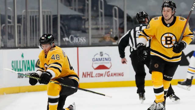 Boston Bruins defensemen Charlie McAvoy, Matt Grzelcyk