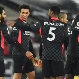 Liverpool forward Mohamed Salah (11), defender Trent Alexander-Arnold (66) and midfielder Georginio Wijnaldum