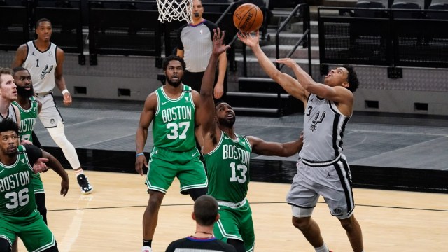 Boston Celtics center Tristan Thompson (13) and San Antonio Spurs forward Keldon Johnson (3)
