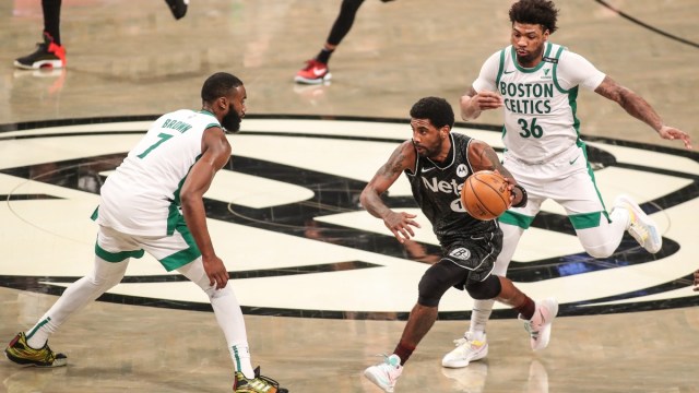Brooklyn Nets guard Kyrie Irving (11) and Boston Celtics guards Jaylen Brown (7) and Marcus Smart (36)