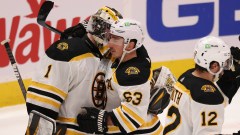 Boston Bruins goalie Jeremy Swayman and forward Brad Marchand