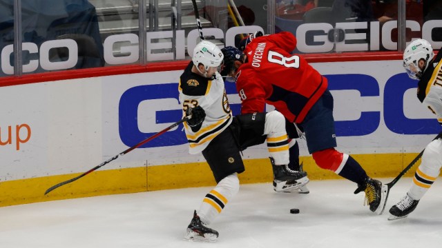 Washington Capitals left wing Alex Ovechkin (8) and Boston Bruins center Cameron Hughes (53)