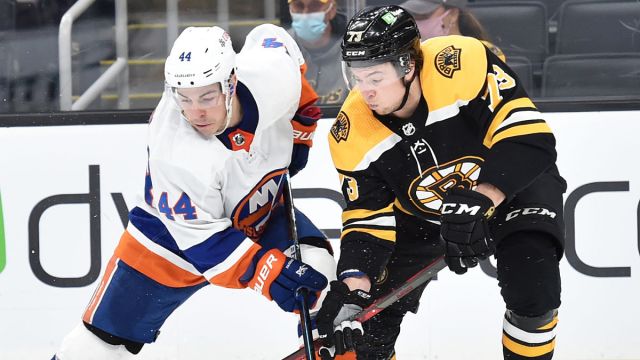 New York Islanders center J.G. Pageau and Boston Bruins defenseman Charlie McAvoy