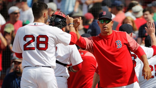 Boston Red Sox manager Alex Cora and designated hitter J.D. Martinez (28)