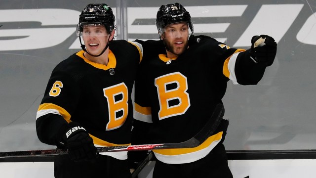 Boston Bruins left wing Taylor Hall and defenseman Mike Reilly
