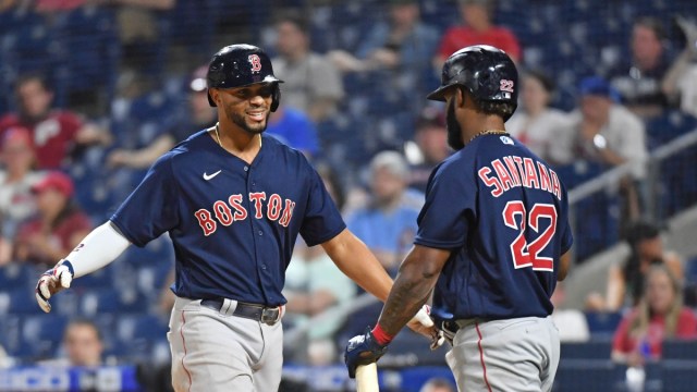 Boston Red Sox shortstop Xander Bogaerts (left) and infielder Danny Santana (22)