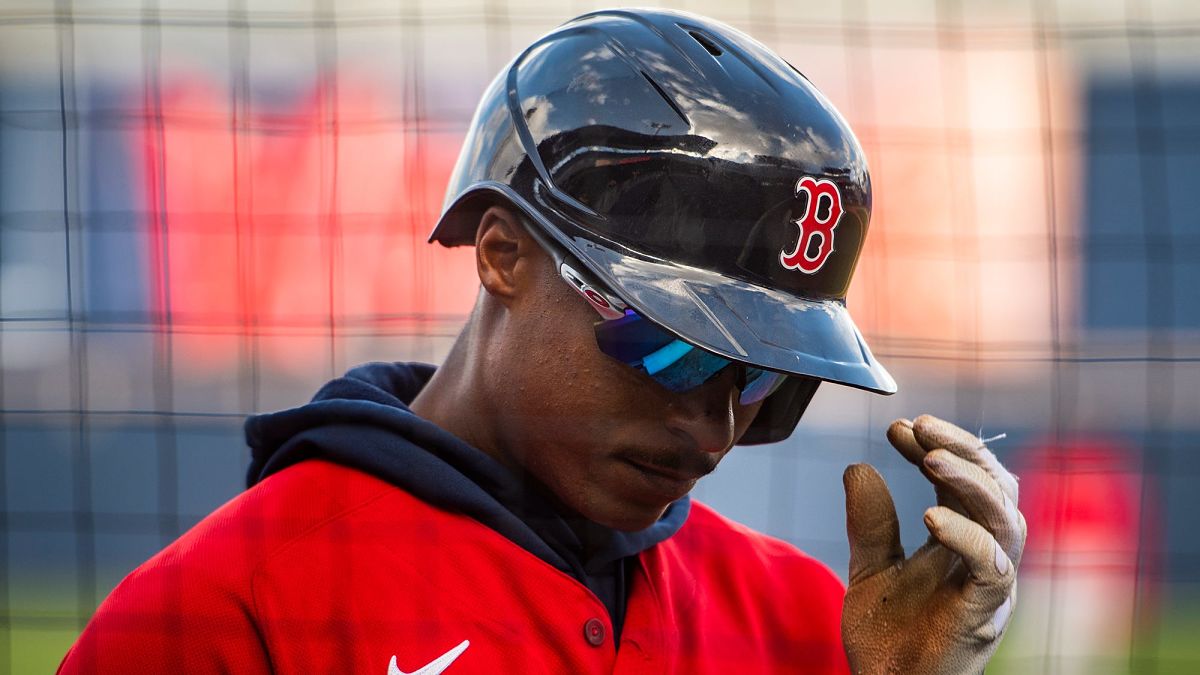 Boston Red Sox's Jeter Downs takes off his batting helmet after