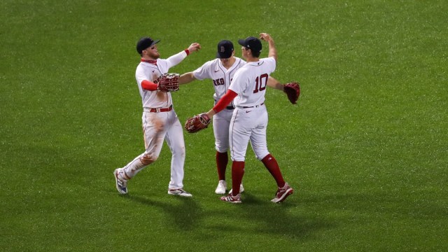 Boston Red Sox center fielder Kiké Hernández (5), right fielder Hunter Renfroe (10) and left fielder Alex Verdugo (99)