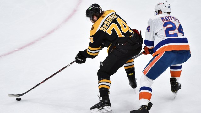 Boston Bruins winger Jake DeBrusk, New York Islanders defenseman Scott Mayfield