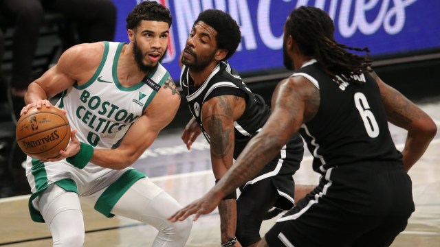 Boston Celtics forward Jayson Tatum (0), Brooklyn Nets point guard Kyrie Irving (11) and center DeAndre Jordan (6)