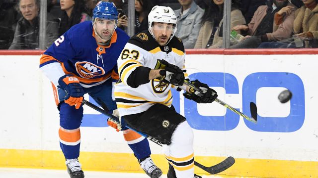 New York Islanders defenseman Nick Leddy and Boston Bruins left wing Brad Marchand
