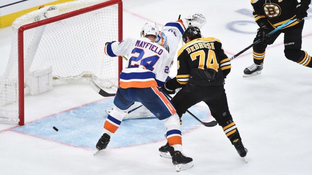Boston Bruins winger Jake DeBrusk and New York Islanders defenseman Scott Mayfield