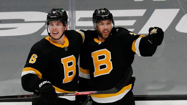 Boston Bruins' Taylor Hall and Mike Reilly
