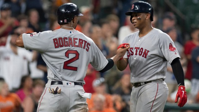Boston Red Sox shortstop Xander Bogaerts (2) and third baseman Rafael Devers (11)