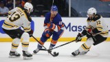 Boston Bruins forwards Charlie Coyle, Craig Smith, New York Islanders forward Anthony Beauvillier