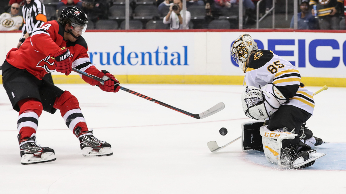 Boston Bruins goaltender Kyle Keyser (85) defends against the New