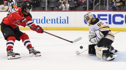 Boston Bruins goalie Kyle Keyser, New Jersey Devils winger Miles Wood
