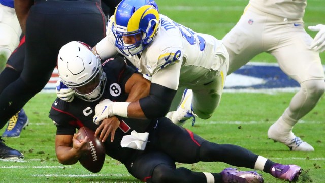 Los Angeles Rams defensive end Aaron Donald (99) and Arizona Cardinals quarterback Kyler Murray (1)