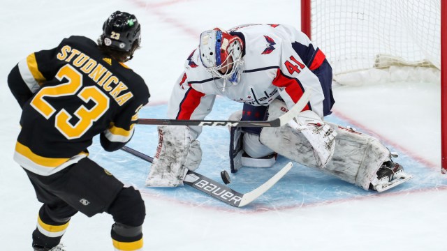 Boston Bruins center Jack Studnicka, Washington Capitals goalie Vitek Vanecek