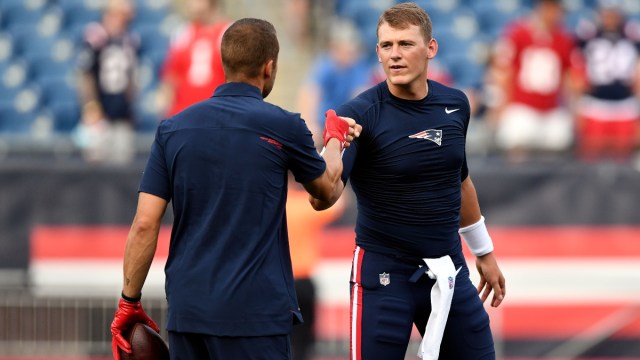 New England Patriots quarterback Mac Jones (right)