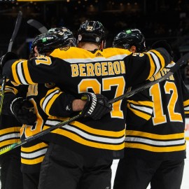 Boston Bruins center Patrice Bergeron (37) and teammates
