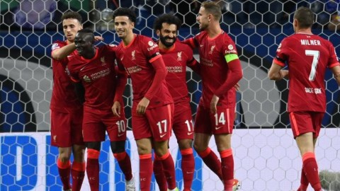 Liverpool players celebrate a goal vs. FC Porto