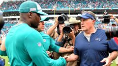 New England Patriots head coach Bill Belichick and former Miami Dolphins head coach Brian Flores