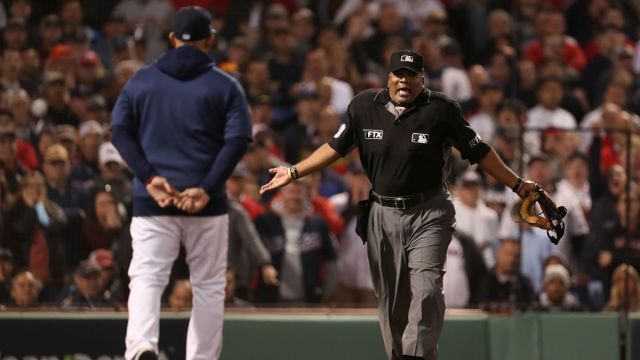 Boston Red Sox manager Alex Cora and Major League Baseball umpire Laz Diaz