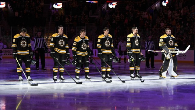 Boston Bruins defenseman Charlie McAvoy (73), center Trent Frederic (11), center Curtis Lazar (20), right wing Karson Kuhlman (83), defenseman Derek Forbort (28), and goaltender Linus Ullmark (35)