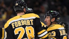 Boston Bruins winger Brad Marchand and defenseman Derek Forbort