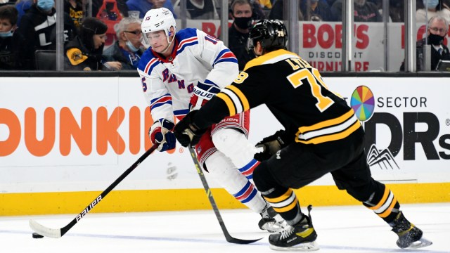 Boston Bruins defenseman Brady Lyle, New York Rangers forward Julien Gauthier