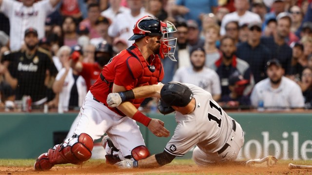 New York Yankees left fielder Brett Gardner (11) and Boston Red Sox catcher Christian Vázquez (7)