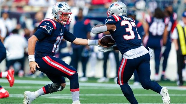New England Patriots quarterback Mac Jones (10) and running back Damien Harris (37)