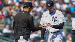 New York Yankees manager Aaron Boone and pitcher Jordan Montgomery