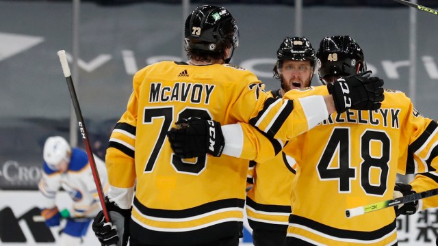 Boston Bruins defensemen Matt Grzelcyk and Charlie mcAvoy