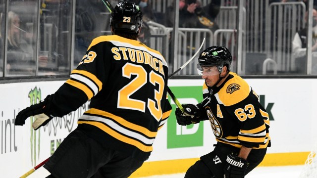 Boston Bruins left wing Brad Marchand (63) and forward Jack Studnicka (23)