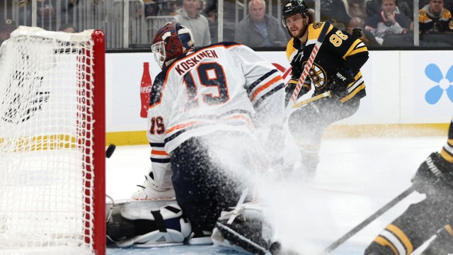 Edmonton Oilers goalie Mikko Koskinen, Boston Bruins winger David Pastrnak