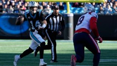 Carolina Panthers quarterback Sam Darnold (14) and New England Patriots outside linebacker Matt Judon (9)