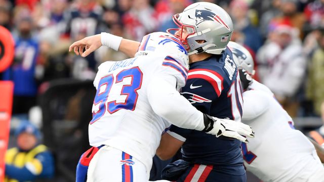 Buffalo Bills defensive end Efe Obada and New England Patriots quarterback Mac Jones