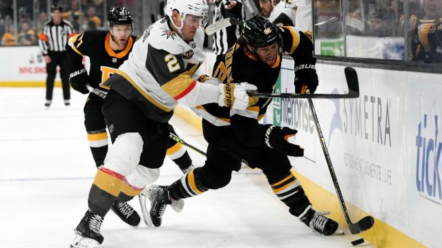 Vegas Golden Knights defenseman Zach Whitecloud, Boston Bruins winger David Pastrnak